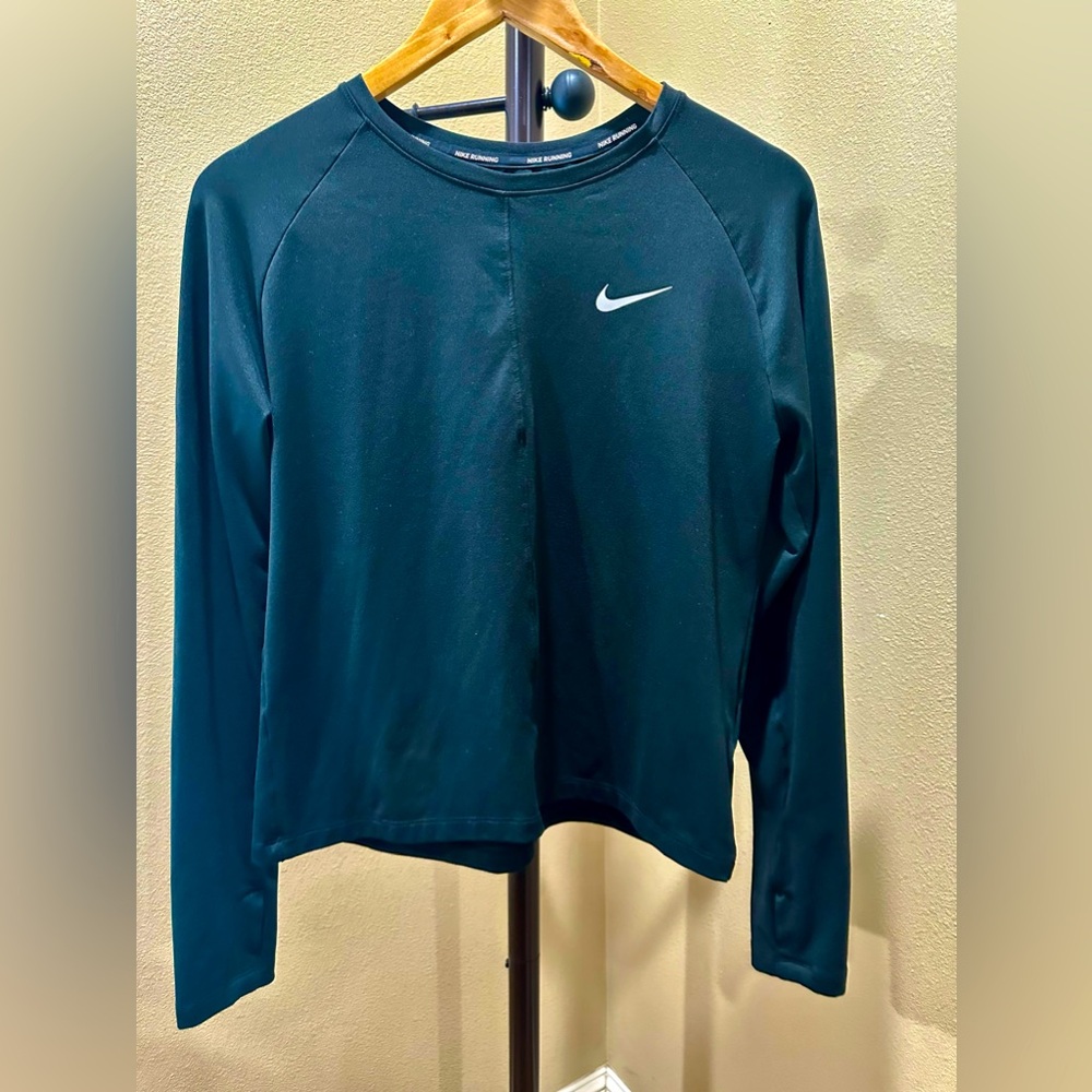 Like a new black Nike dri fit running long sleeve size medium